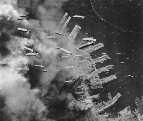 Incendiary bombs are dropped by U.S. Army Air Forces on Kobe, Japan, 4 June, 1945.